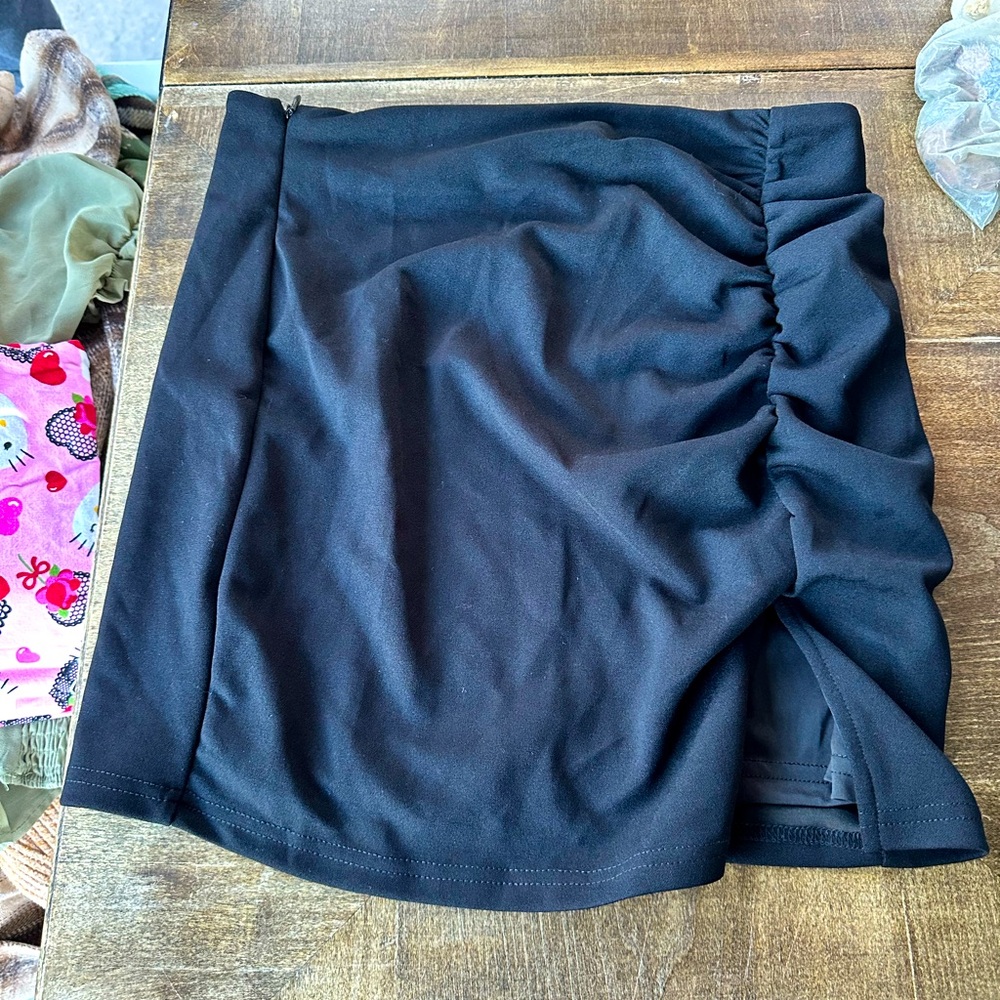 Mini skirt with small slit in the front